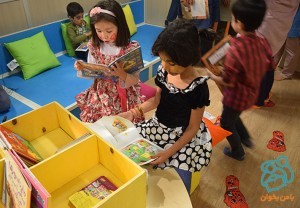 Children looking at books in Read with Me library / Kousha House of Kids - Sep 2015
