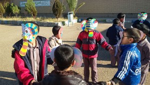 Children playing with masks made by themselves from book characters - Read with Me in South Khorasan - Jan 2016