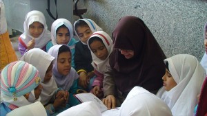 A tutor reads aloud with children - Read with Me in Zabol - Jan 2016