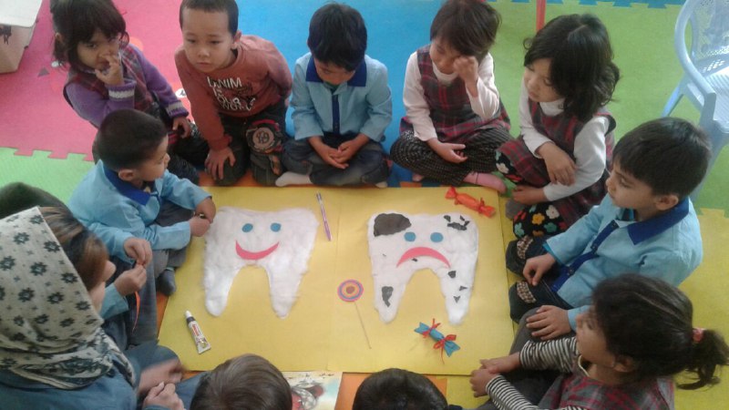 Children making crafts related to books - Read with Me in MahmoodAbad