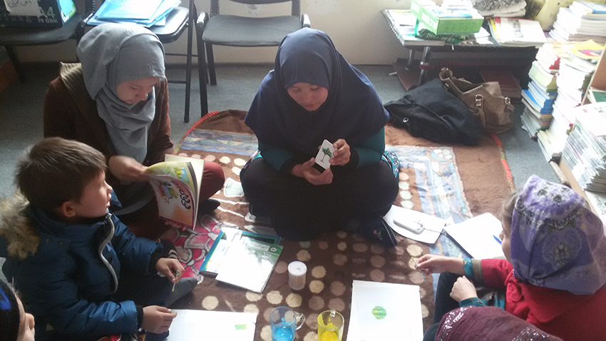 A RWM trainer works on "Learning Math package" with children - RWM in Mazar-e-Sharif (2016)